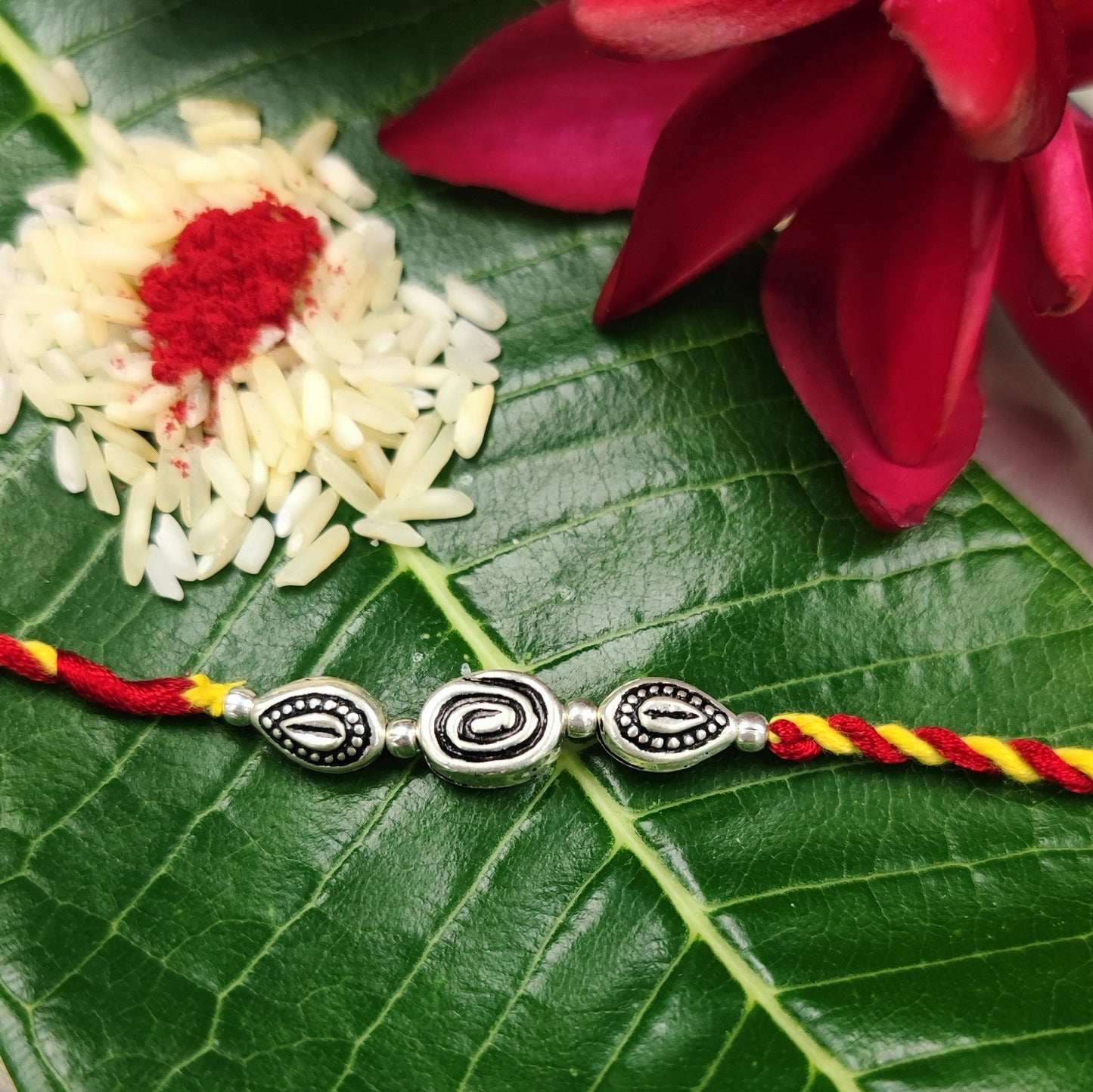 Silver Jewelry Rakhi by Jauhri 92.5 Silver Rakshabandhan Special - Cookie Leaf Rakhi