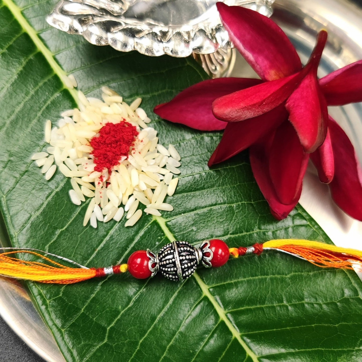 Silver Jewelry Rakhi by Jauhri 92.5 Silver Rakshabandhan Special - Silver Bead Coral Rakhi