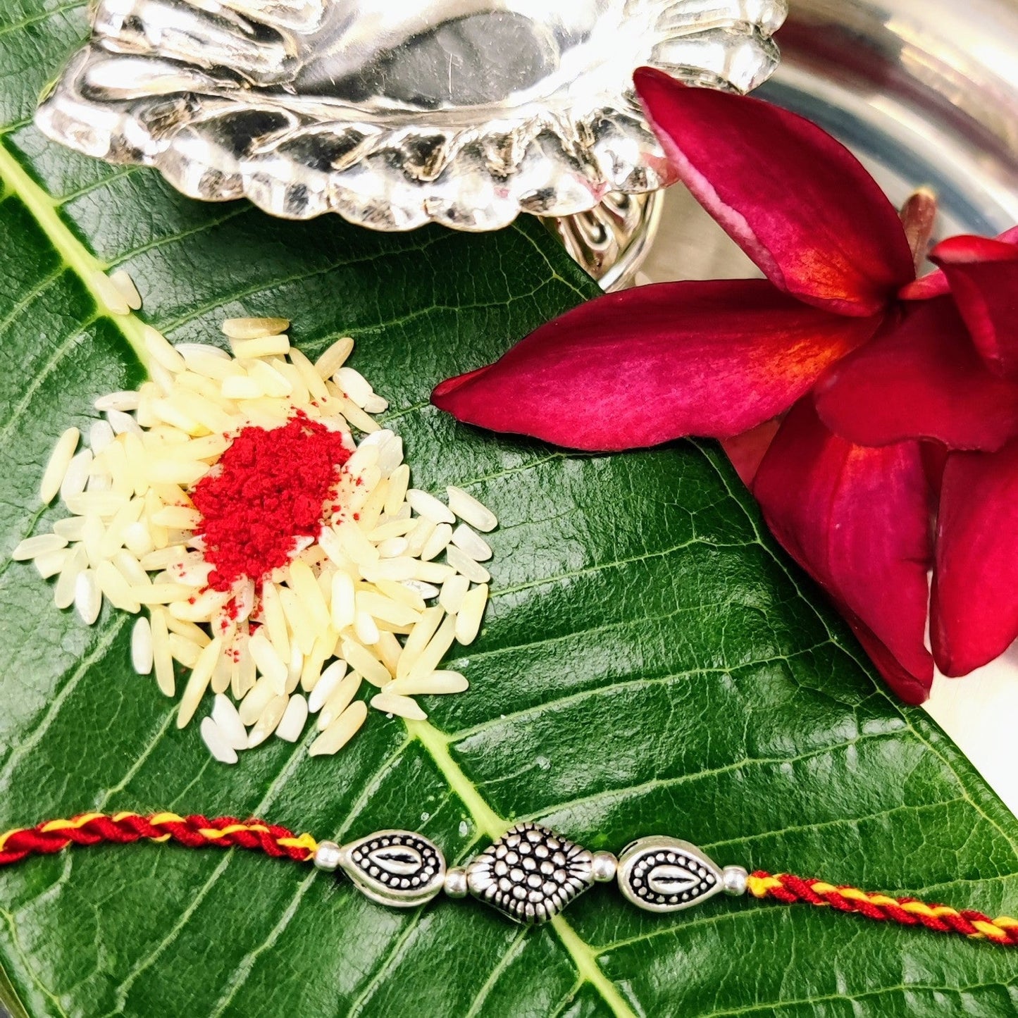 Silver Jewelry Rakhi by Jauhri 92.5 Silver Rakshabandhan Special - Ita Leaf Rakhi