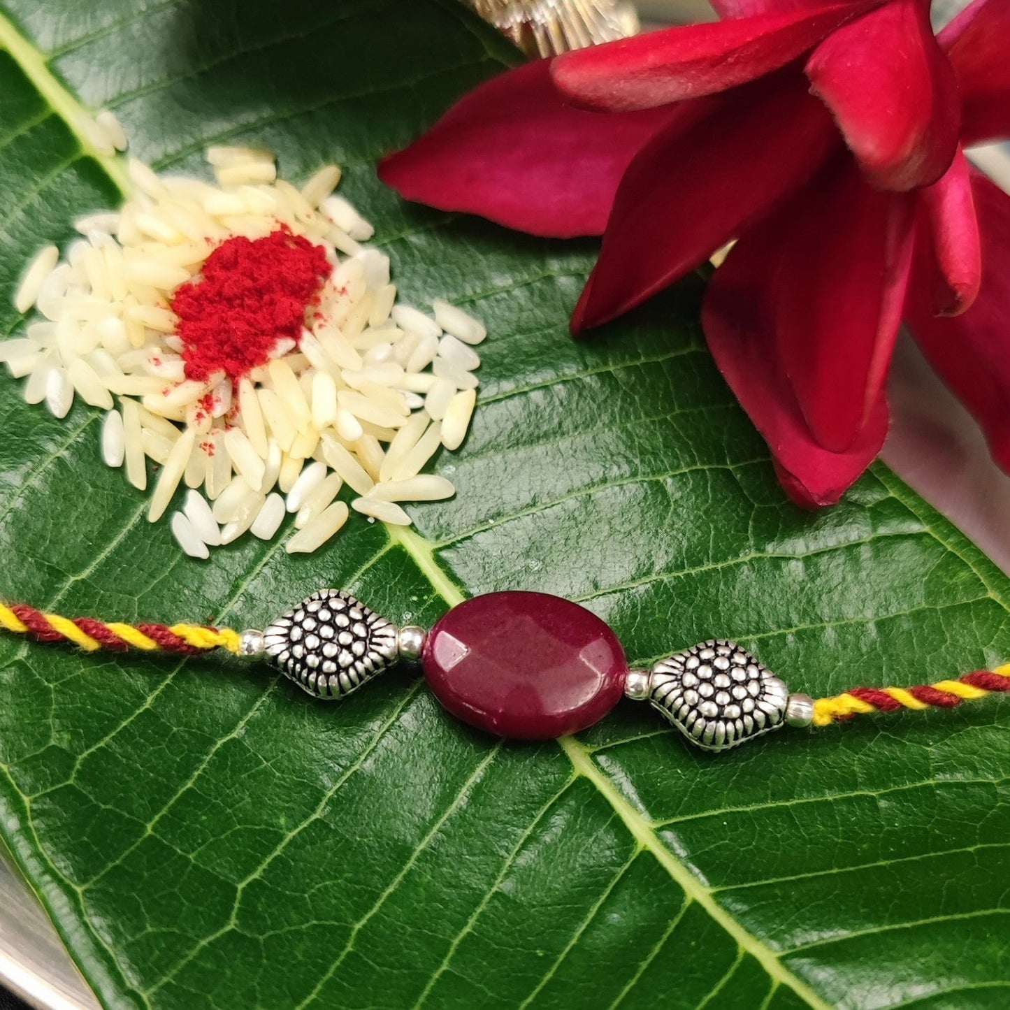 Silver Jewelry Rakhi by Jauhri 92.5 Silver Rakshabandhan Special - Pink Stone Ita Rakhi