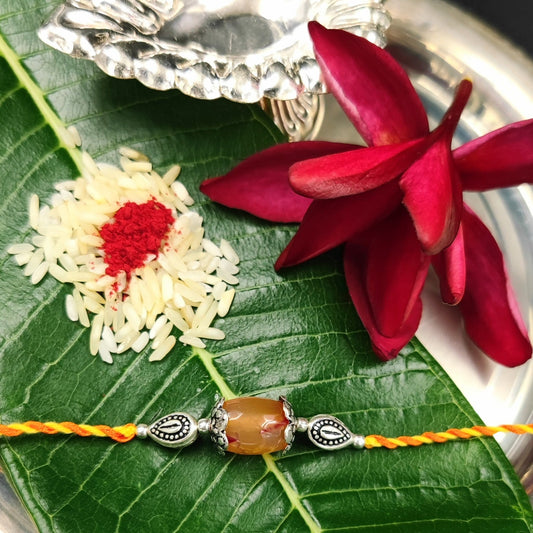 Silver Jewelry Rakhi by Jauhri 92.5 Silver Rakshabandhan Special - Orange Stone Flower Rakhi