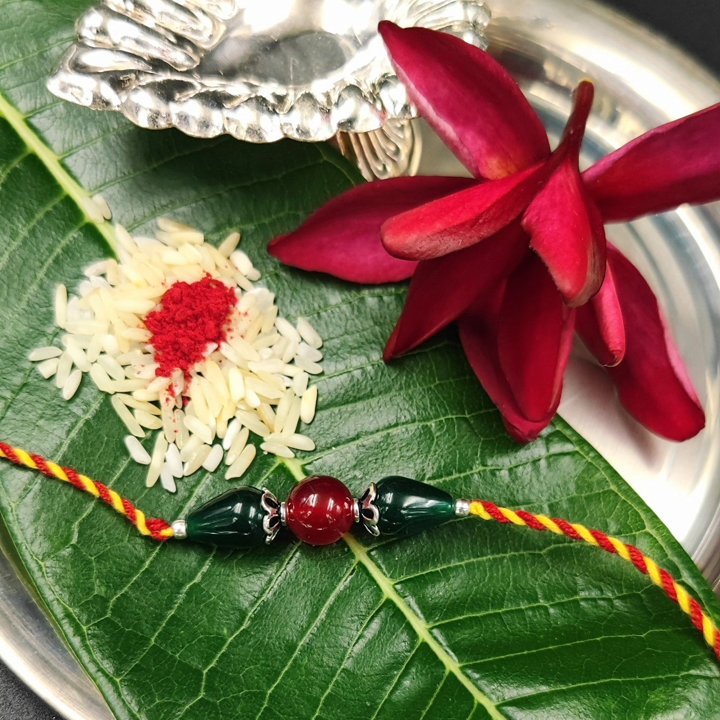 Silver Jewelry Rakhi by Jauhri 92.5 Silver Rakshabandhan Special - Red Green Rakhi