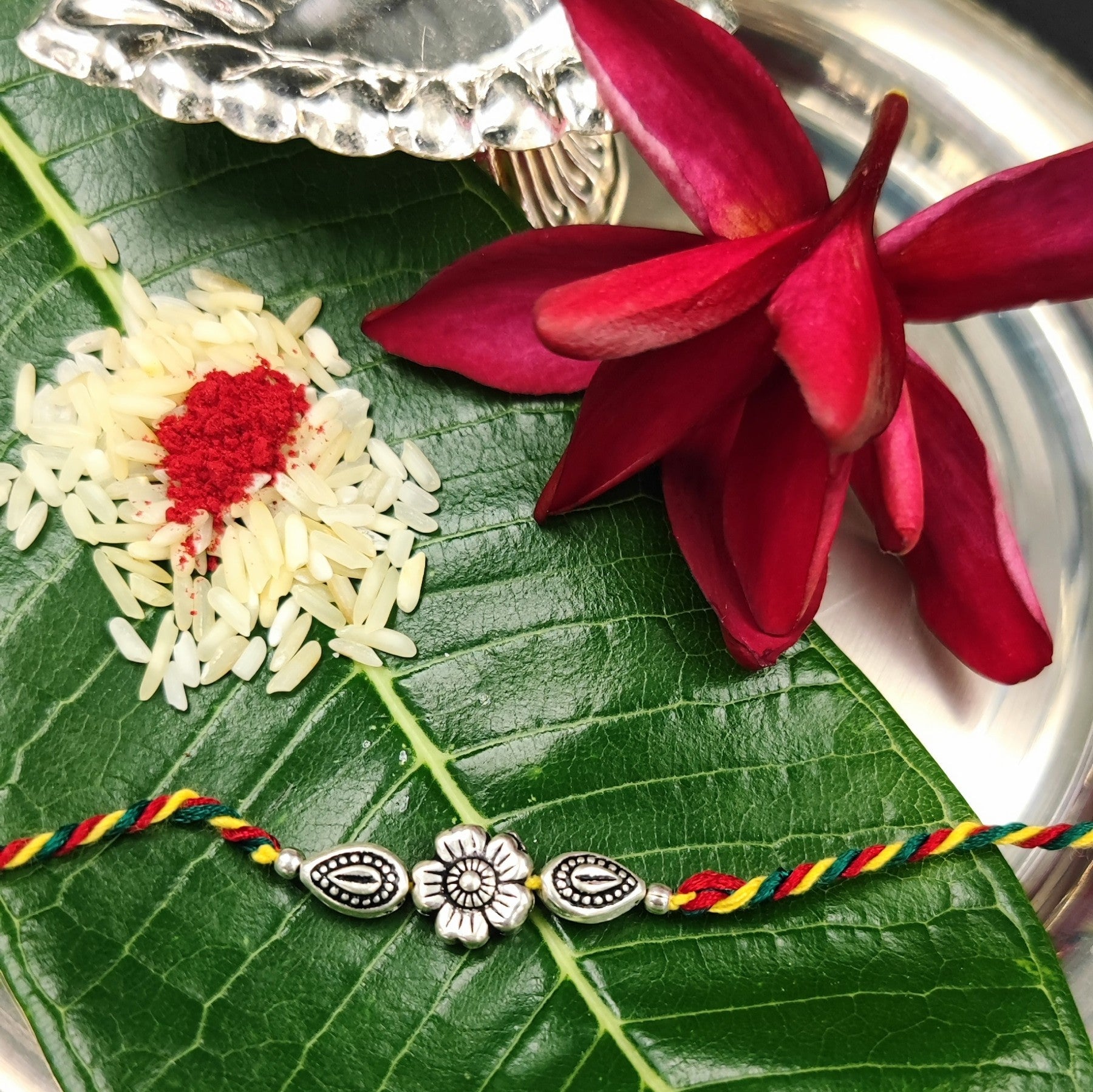 Silver Jewelry Rakhi by Jauhri 92.5 Silver Rakshabandhan Special - Flower Leaf Rakhi