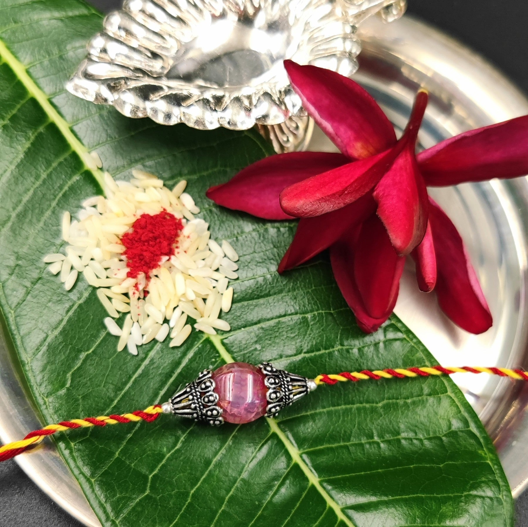 Silver Jewelry Rakhi by Jauhri 92.5 Silver Rakshabandhan Special - Cone Stone Rakhi
