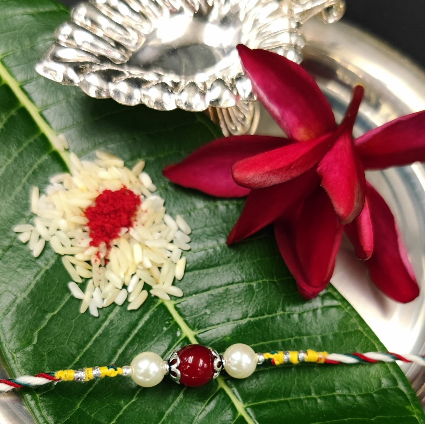 Silver Jewelry Rakhi by Jauhri 92.5 Silver Rakshabandhan Special - Pink Pearl Rakhi